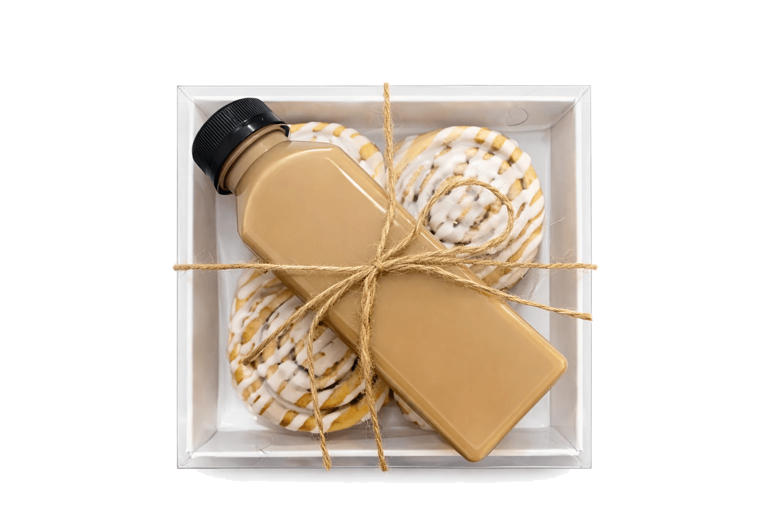 Freshly iced cinnamon buns prepared with coffee for delivery