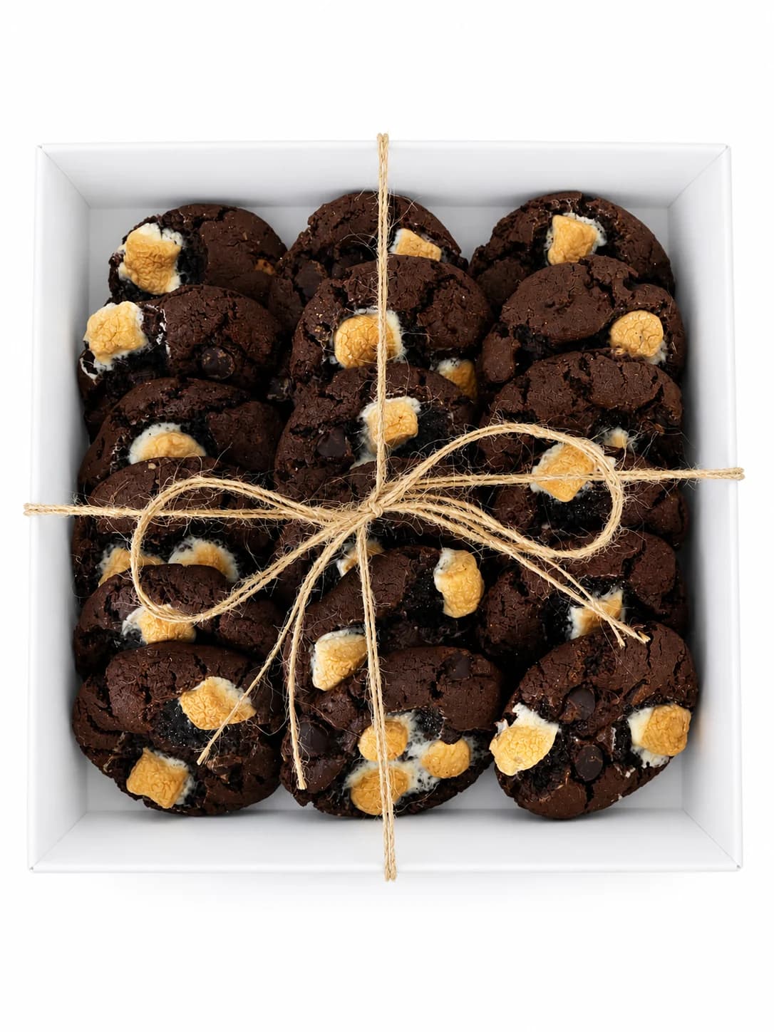 A Sugar and Crumbs cookie gift box tied with twine