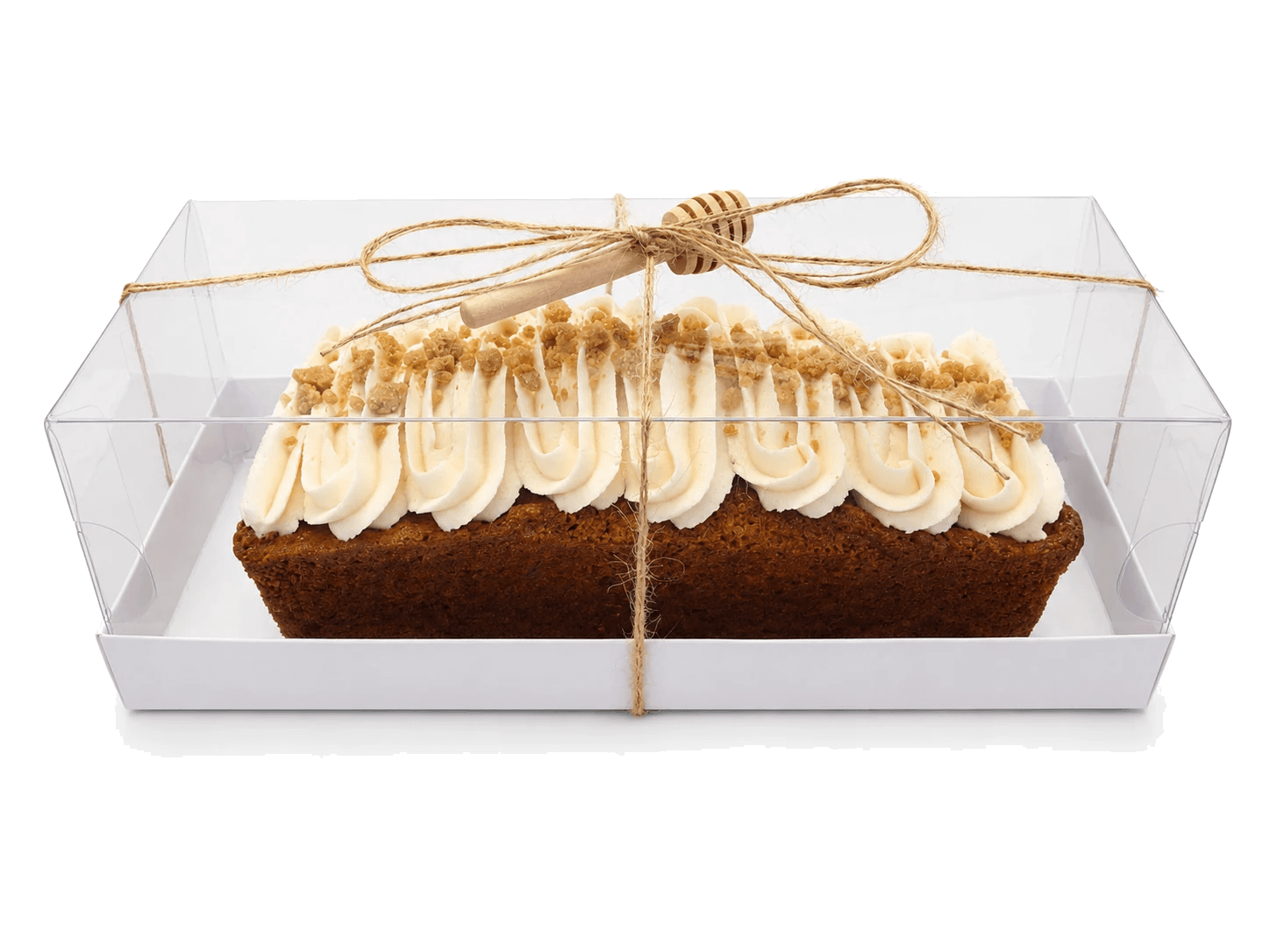 Honey cream log cake packaged with twine and a wooden honey dipper